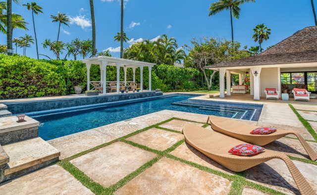 Coral Reef - Pool and lounge chairs at daytime - Oahu Vacation Home