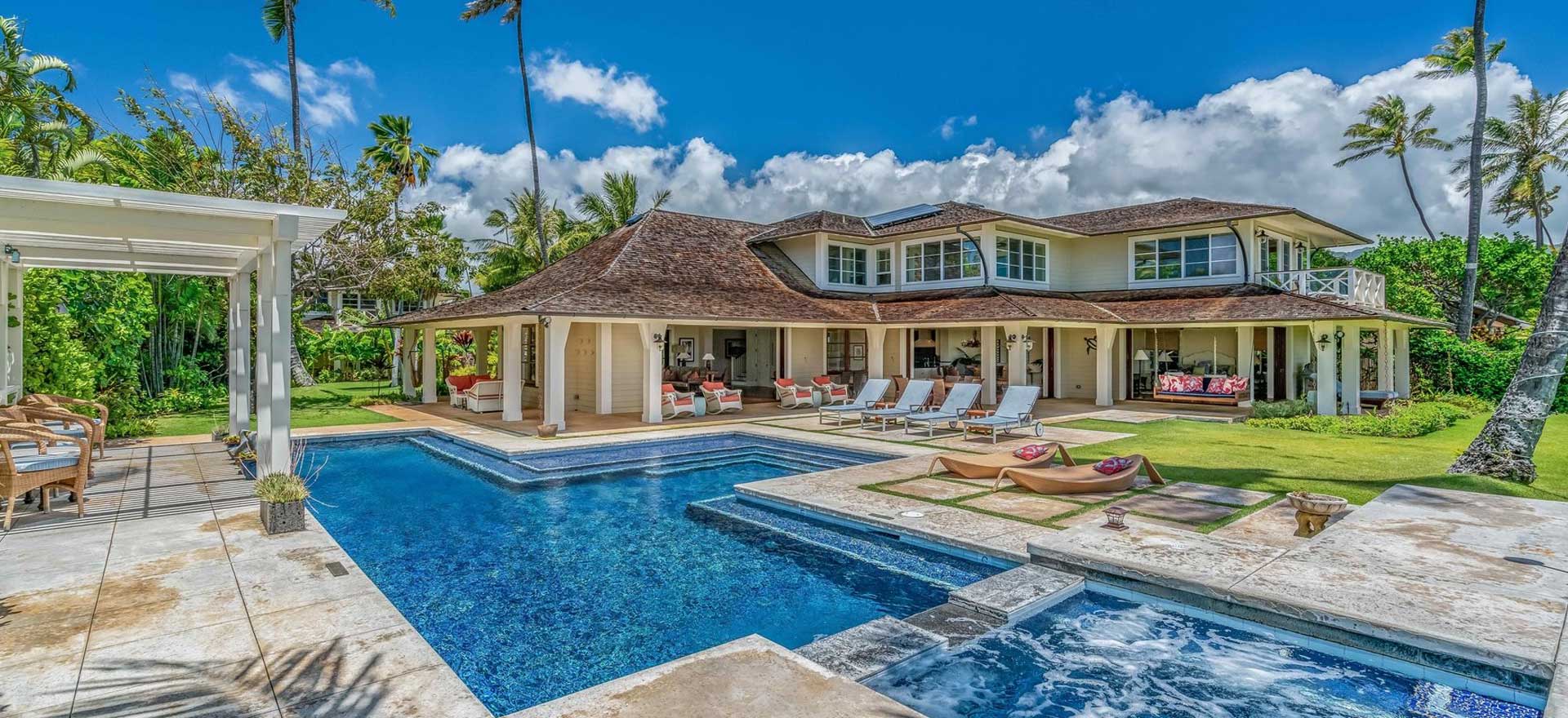 An image of the pool and back of the Coral Reef villa for rent